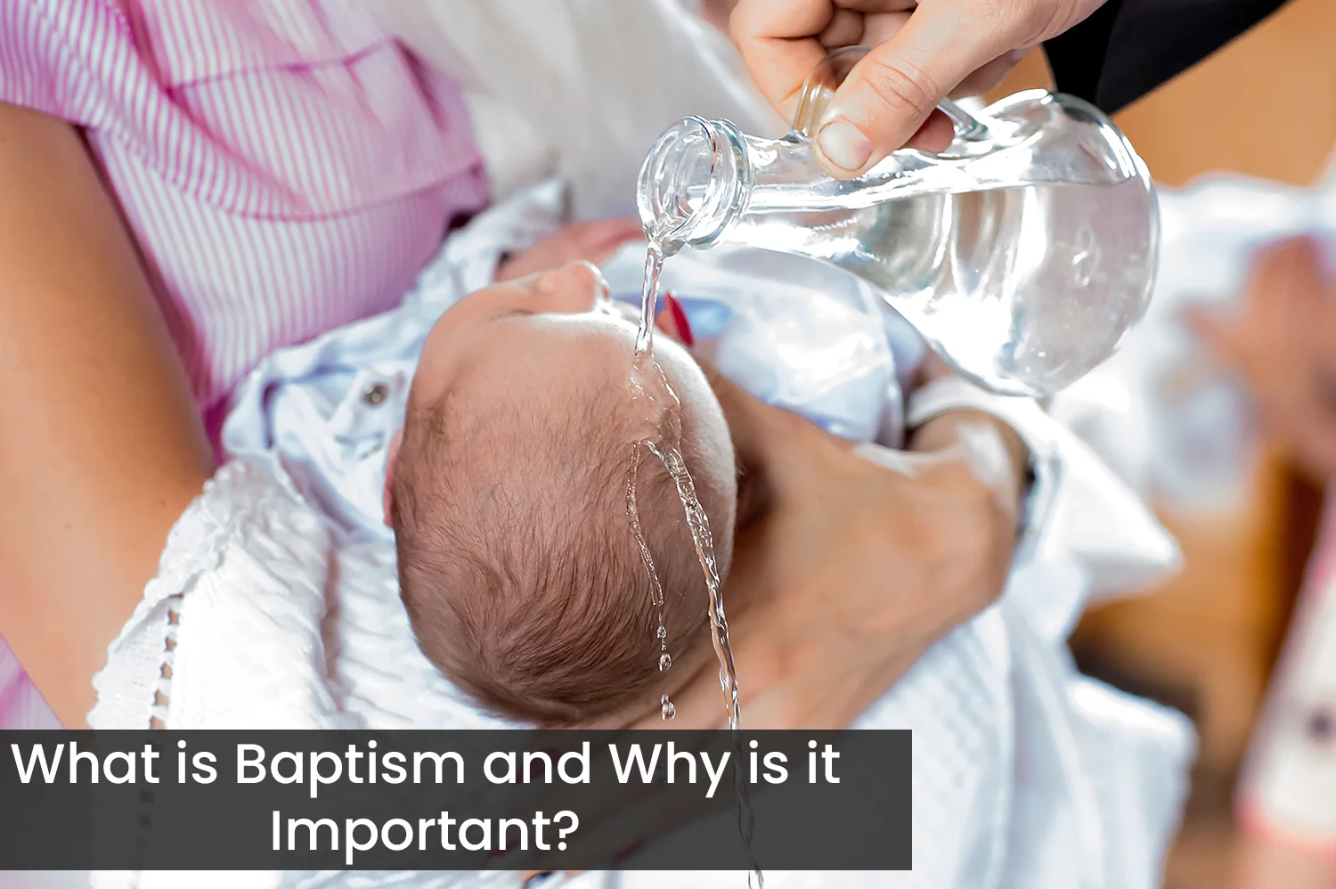 An anonymous woman holding her baby during their baptism.